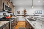 Beautiful granite kitchen countertops, and gas range